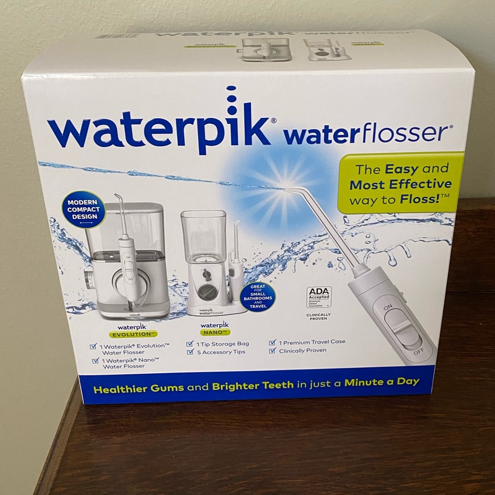 New with seal combo pack. Includes waterpik evolution and waterpik nano together
